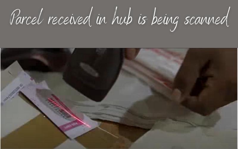 st courier parcel received in hub is being scanned